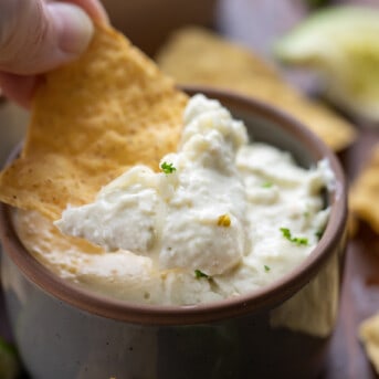 Dipping a Chip into Easy Queso.